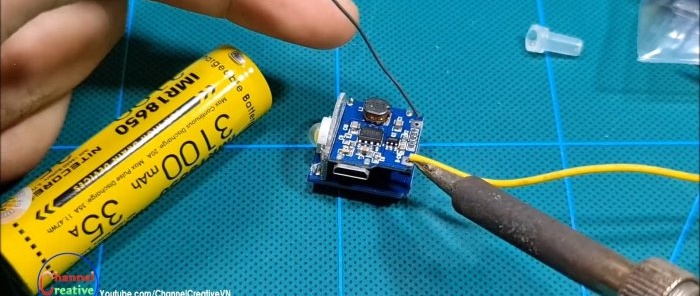 The power bank module is soldered to the battery