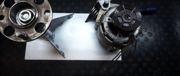Hvordan sette sammen en maskin for sliping av bremseskiver fra en vaskemaskinmotor hjemme