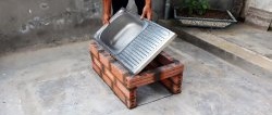 Hvordan lage en utendørs ovn billig fra en gammel vask