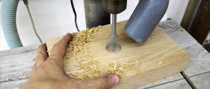Cara membuat peranti untuk memusing bahan kerja silinder dan kon yang besar pada gergaji bulat