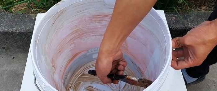 Sådan laver du en røgfri komfur ved hjælp af cement og et par plastikspande