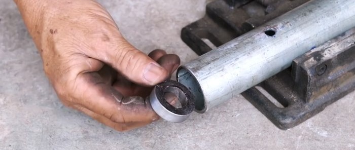 Hoe je een krik maakt van de versnellingsbak en tandwielen van een motorkettingslijpmachine