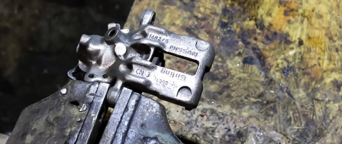 How to remove rust and restore a car part in a garage
