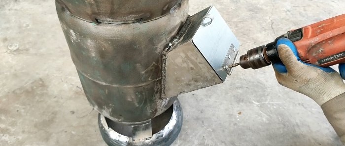 Paano gumawa ng 2 in 1 wood stove mula sa isang gas cylinder na may parallel na pagpainit ng tubig