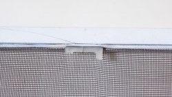 How to remove a mosquito net from a window if the handles are broken