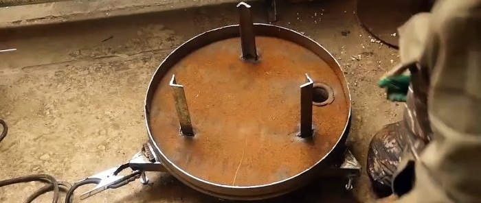 Hoe maak je een lang brandende kachel van schroot