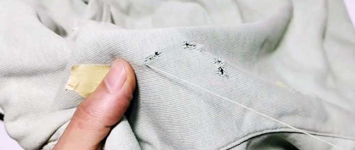 Hur man tyst syr upp ett hål i kläder